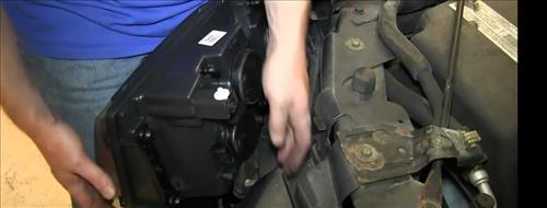 How To Install Replace Headlight and Change Bulb 2002-09 GMC Envoy step 13