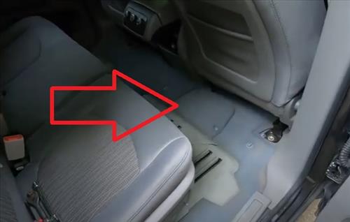 Where is the Battery Located in a Chevrolet Traverse Behind Passeneger Seat